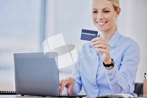 Image of Business woman, laptop and credit card with online shopping, smile and cybersecurity at desk. Young female entrepreneur, e commerce and happy with payment, password or info for discount, sale or deal