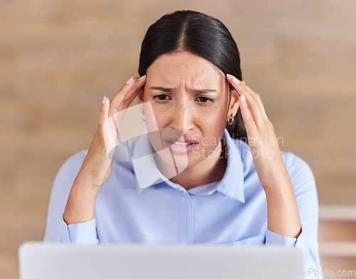 Image of Business woman, headache and laptop in stress, depression or anxiety for fail or mistake at office. Face of frustrated female person or employee on computer in debt, bankruptcy or doubt at workplace