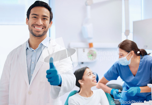 Image of Consulting, thumbs up and portrait of dentist with patient for teeth whitening, service and dental care. Healthcare, dentistry and hand sign of orthodontist for oral hygiene, wellness and cleaning