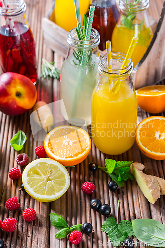 Image of Preparing refreshing summer drinks and lemonade with fruits and berries