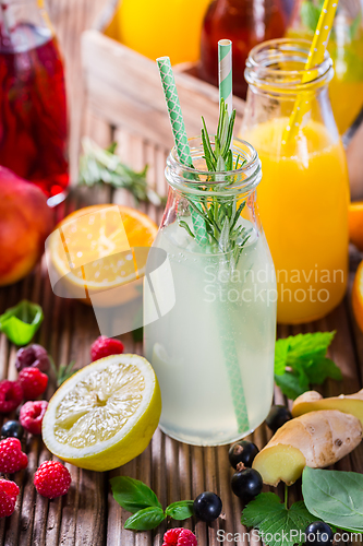 Image of Preparing refreshing summer drinks and lemonade with fruits and berries