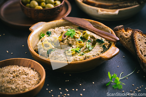 Image of Traditional arabian eggplant dip (baba ganoush) on rustic dark t