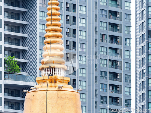 Image of Golden pagoda and modern condo in Bangkok, Thailand