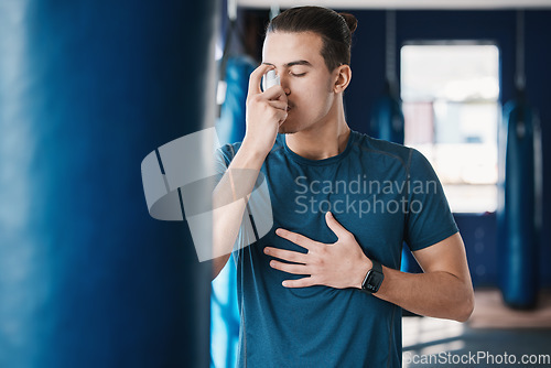 Image of Asthma pump, breathe and man with fitness, medicine and wellness spray for health. Breathing, inhaler and lung relief with a male person in a gym with workout and medical problem support for care