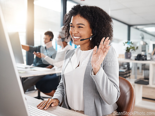 Image of Consultant, woman call center agent with headset and computer at her desk in a modern workplace office with a lens flare. Telemarketing, online communication or customer service and African female