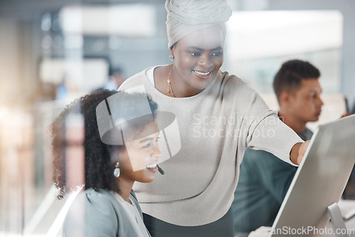 Image of Call center, training and black woman with employee on computer for customer service, support or telemarketing. Coaching, sales agent and mentor teaching intern crm, help desk and learning consulting