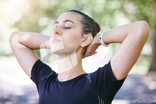 Image of Fitness, runner or woman stretching her neck for workout or body movement while relaxing on break. Wellness, athlete or healthy girl in exercise training warm up for flexibility or mobility in park