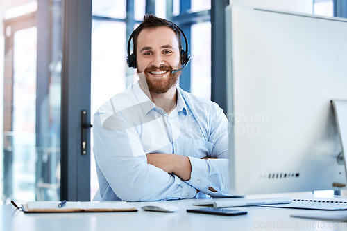 Image of Call center, arms crossed and portrait of business man in office for customer service, communication and contact us. Help desk, advice and sales with male employee for networking and receptionist