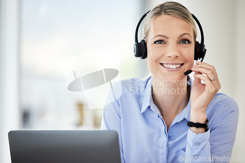 Image of Customer service, portrait of woman call center agent and with headset at her modern office. Telemarketing or consultant, networking or crm and female person happy for support at workstation
