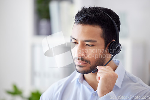 Image of Man, focus and agent with telemarketing, call center and help with customer service, thinking and professional. Male person, serious employee or consultant with tech support, headset or concentration