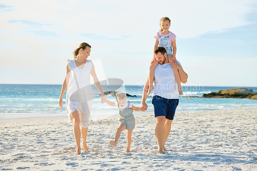 Image of Vacation, holding hands and travel with family at beach for summer, happy and bonding. Freedom, support and ocean with parents and children walking ion seaside holiday for love, care and happiness