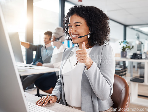 Image of Call centre, woman and thumb up for online support with smile for success with headset, computer. Customer service, telemarketing and worker is happy with hand gesture for motivation and agreement.