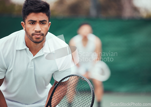 Image of Male athlete, serious on tennis court for a competition with team and exercise in india. Man, racket and together for game at sports club in the outdoor for fitness with challenge to play in closeup.