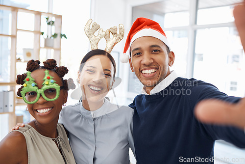 Image of Selfie, christmas and a friends at an office party together at an end of year function for celebration. Portrait, smile and festive with a happy group of colleagues posing for a photograph at work