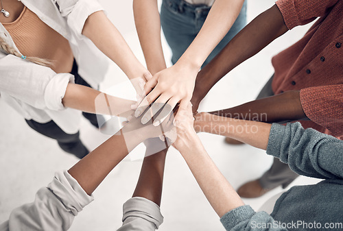 Image of Teamwork, hands of people together in huddle for support, strategy and collaboration at start up. Team, coworking and hand circle with trust, group of staff working with cooperation and diversity.