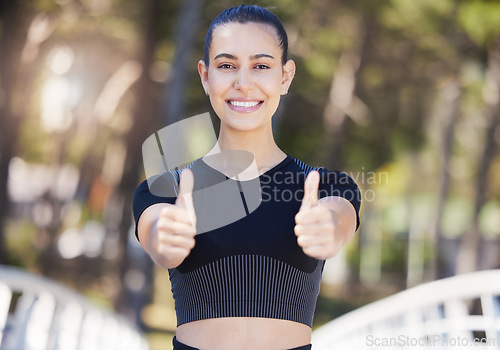 Image of Runner, portrait or happy girl with thumbs up in park for fitness training with positive mindset or smile. Motivation, workout or woman smiling with like sign, hand gesture or thumb up in nature