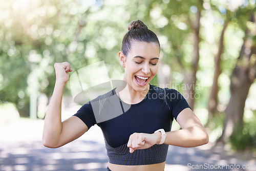 Image of Success happy girl or runner with smartwatch in park for heart rate to monitor training or exercise progress. Excited, yes or healthy sports athlete with timer celebrates running workout or fitness