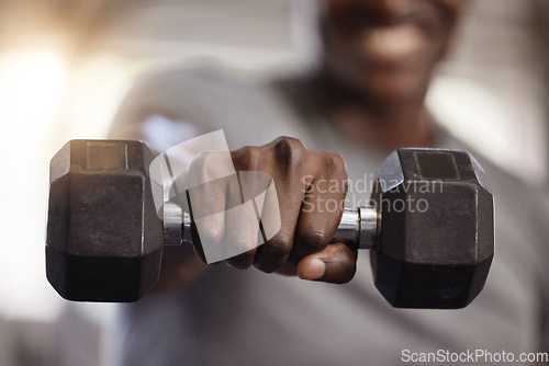 Image of Dumbbells, hand and exercise closeup at gym for fitness, training workout and strong muscle. Athlete or bodybuilder person with a fist and iron weights for power and performance at a wellness club