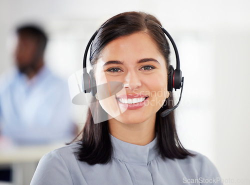 Image of Customer service, portrait of woman with headset and happy at her desk in a modern workplace office. Telemarketing or consultant, support or crm and female call center agent happy at workstation