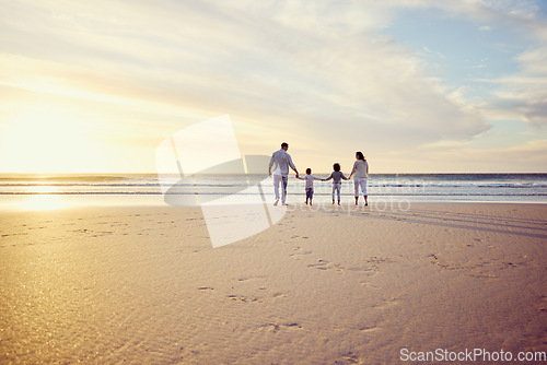 Image of Sunset, travel and family holding hands on beach walking on holiday, summer vacation and weekend. Nature, mockup and mother, father and children by ocean for bonding, adventure and quality time