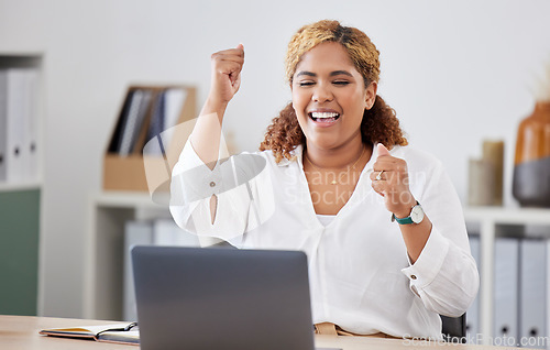 Image of Happy, businesswoman with celebration and with laptop at her desk in a modern office workplace. Achievement or success, happiness or cheerful and celebrate female person smile for goal or target