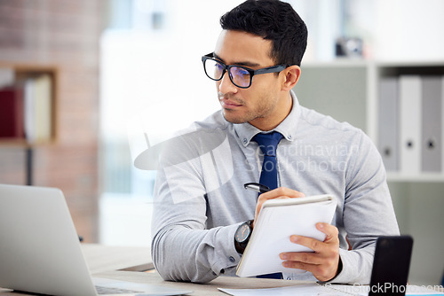 Image of Writing, computer and business man, accountant or employee of finance, budget or analysis in career notebook. Journal, bookkeeping notes and person reading financial report on laptop for job priority