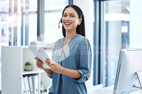 Image of Smile, tablet and call center woman in office with a headset, internet connection and database app. Latino person or consultant laughing for funny crm communication, telemarketing or customer service