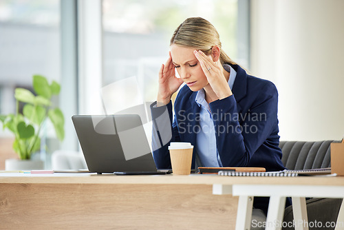 Image of Burnout, frustrated and female professional with a headache in a workplace on a laptop with entrepreneur. Fatigue, business person and anxiety with pain at company with depression and technology.