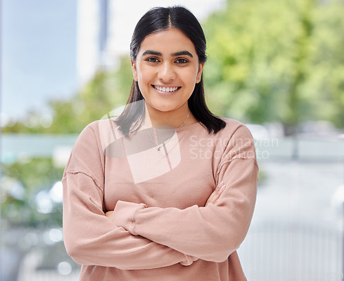 Image of Smile, portrait and face of a young woman at home with arms crossed, happiness and confidence. Portrait of Indian female model person with a positive mindset, beauty and blurred background to relax