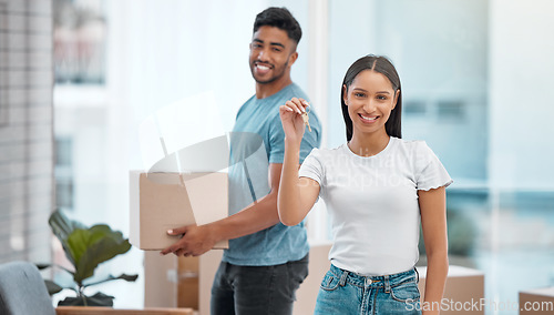 Image of Box, keys and portrait of couple in new home excited for property, apartment and real estate investment. Relationship, moving day and man and woman with key and boxes for relocation, move and house