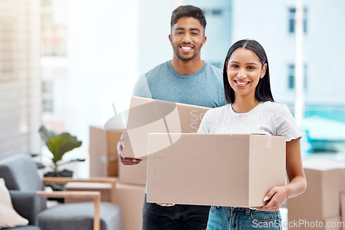 Image of Box, happy and portrait of couple in new home excited for property, apartment and real estate investment. Relationship, moving day and man and woman carrying boxes for relocation, move and house