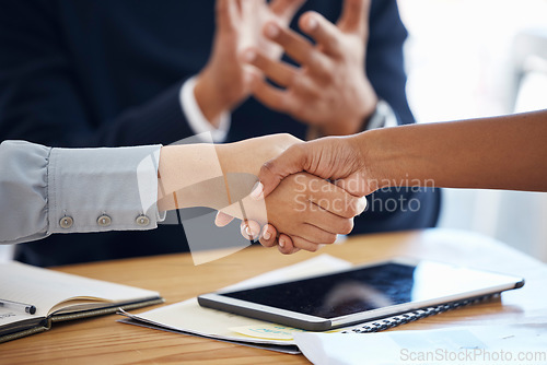 Image of Thank you, colleagues shaking hands and in a business meeting in a modern office together. Partnership or collaboration, congratulations or agreement and coworkers with handshake for teamwork