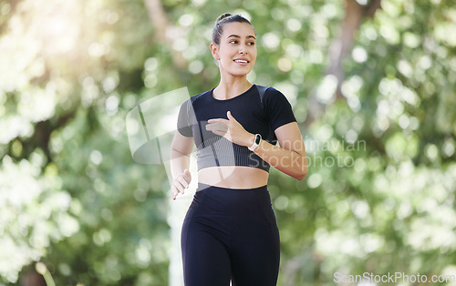 Image of Smile, fitness or happy woman running in park training, cardio exercise or body workout for marathon. Wellness, athlete runner smiling or healthy sports girl exercising on jog outdoors in nature