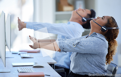 Image of Call center, team and stretching in office while consulting for contact us, crm or customer care. Workforce, stretch and telemarketing consultant online for help, advice and service with joint relief