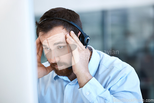 Image of Stress, computer and tired call center man with a headset for customer support problem or headache. Frustrated person at pc for telemarketing account crisis, contact us or sales fail, mistake or loss