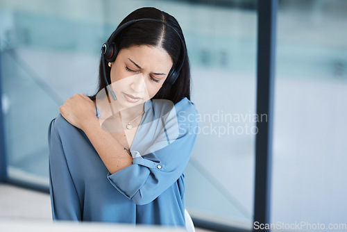 Image of Call center, tired agent or woman with shoulder pain and headset in telemarketing, sales or crm office. Frustrated customer care consultant person back ache problem, burnout and posture or stress