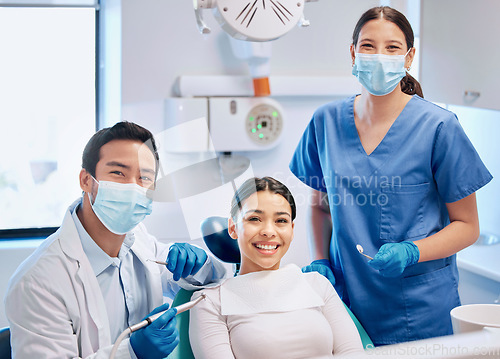 Image of Portrait of dentist and patient in consultation for teeth whitening, service and dental care. Healthcare, dentistry and orthodontist with equipment for woman for oral hygiene, wellness and cleaning