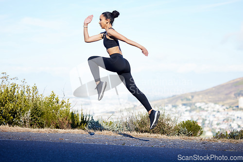 Image of Woman, fitness and running jump on mountain for exercise, workout or cardio training in nature. Fit, active and sport female person, athlete or runner jumping in sports motivation on mockup space