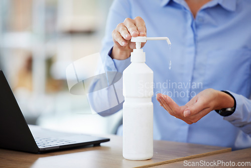 Image of Hands, sanitizer and cleaning in office for health, safety and wellness for hygiene. Sanitize, business person and disinfect hand from bacteria, virus or germs for protection from covid in workplace