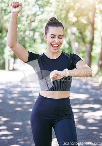 Image of Success, happy woman or athlete with smart watch in park for heart rate, training performance or exercise goals. Excited, yes or healthy sports girl with timer celebrates running workout or fitness