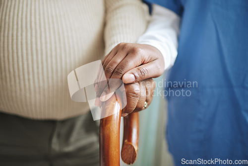 Image of Cane, senior patient and nurse holding hands for support, healthcare and kindness at nursing home. Elderly person and caregiver together for homecare, rehabilitation or help for health in retirement