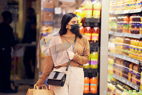 Image of Woman in mask, grocery shopping and supermarket, safety from virus and retail. Groceries choice, refrigerator with stock and female customer safe from bacteria in shop, commercial service and sale