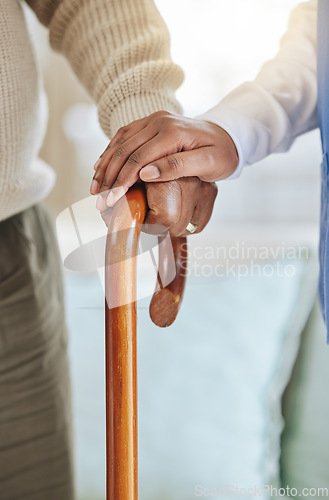 Image of Elderly patient, cane and nurse holding hands for support, healthcare and kindness at nursing home. Senior person and caregiver together for homecare, rehabilitation or help for health in retirement