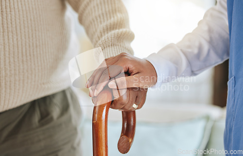 Image of Nurse, holding hands and patient with cane for help, healthcare or support at nursing home. Elderly person and caregiver together for trust, homecare and counselling or empathy for retirement health