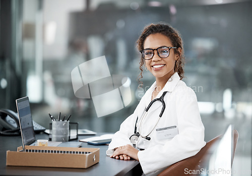 Image of Doctor, happy woman in healthcare and portrait with medical professional, confident with stethoscope and laptop. Female person in medicine, desk and health insurance with cardiologist at hospital