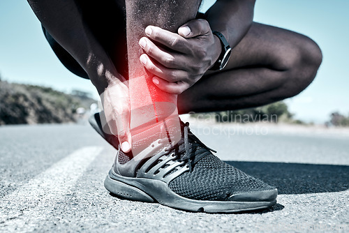Image of Fitness, ankle and injury with a sports man holding his joint in pain while outdoor for a workout. Exercise, emergency and accident with a male athlete feeling tender while training for recreation
