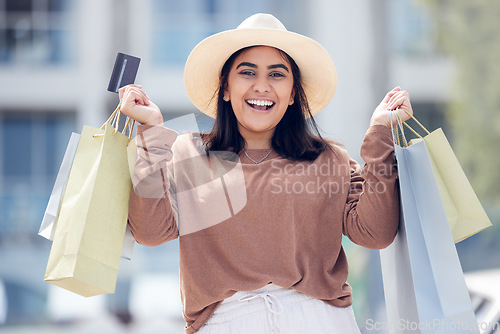 Image of Woman, smile with credit card and shopping bag at mall with luxury, retail and excited for shop discount. Happy female customer at outdoor market, fashion and buyer choice banking budget and sale