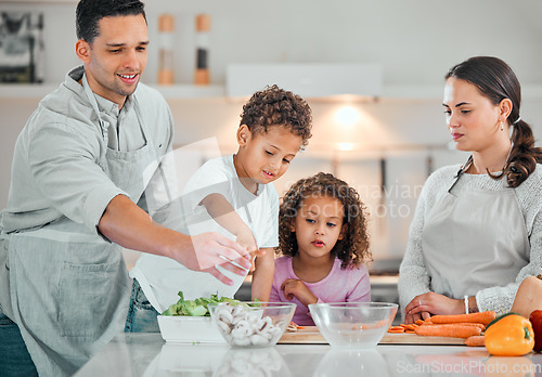 Image of Cooking, help and support with family in kitchen for health, nutrition and food. Diet, vegetables and dinner with parents and children with meal prep at home for wellness, organic salad and learning