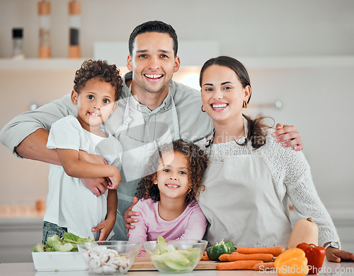 Image of Cooking, smile and portrait of family in kitchen for health, nutrition and food. Diet, vegetables and dinner with parents and children with meal prep at home for wellness, organic salad and learning