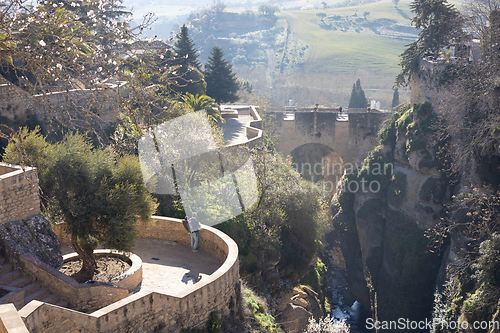 Image of Panoramic view of hanging gardens of Cuenca over El Tajo Gorge with whitewashed houses of Ronda, Andalusia, Spain.